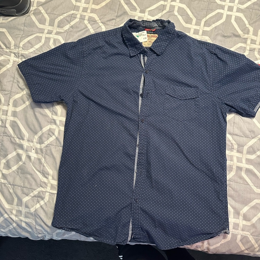 Blue polka dot shirt with purple dots.